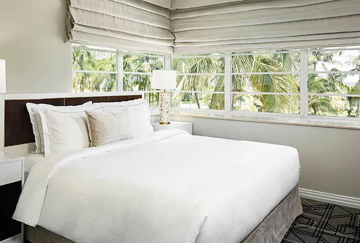 A photo of a master suite bedroom at Hilton Grand Vacations Club McAlpin Ocean Plaza Miami with the text 'Miami, Florida. McAlpin Ocean Plaza'