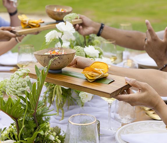 A close up shot of a group of people sharing Spanish tapas at Kingsmill Resort in Williamsburg, Virginia.